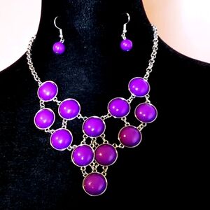 A lovely necklace and earrings set in silver and purple.